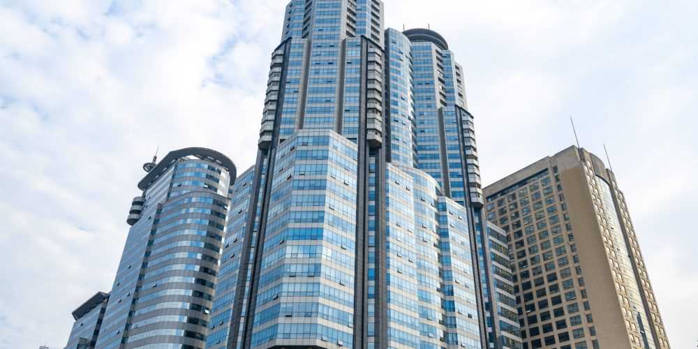 Looking Up Blue Modern Office Building